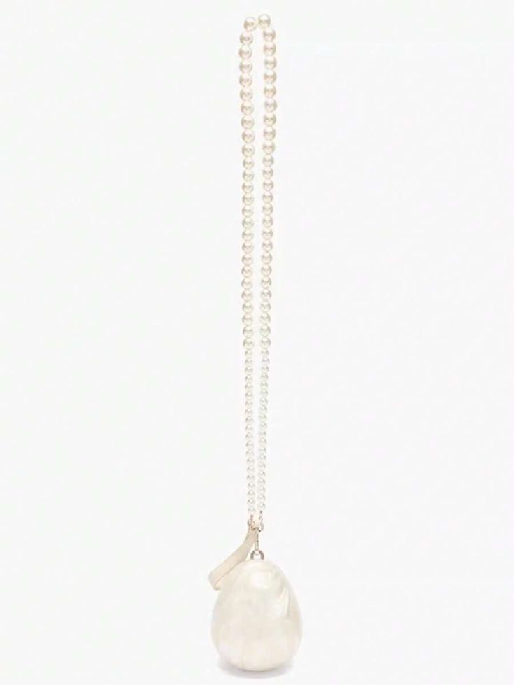 Our Peggy Bag pearly white acrylic egg-shaped mini bag, shown against a white background. Versatile interchangeable handles, as a clutch with a small cream leather wrist strap or a cross body pearl beaded shoulder bag. Highlighting the sheen of the acrylic resin design. The ultimate bridal accessory or statement event bag.
