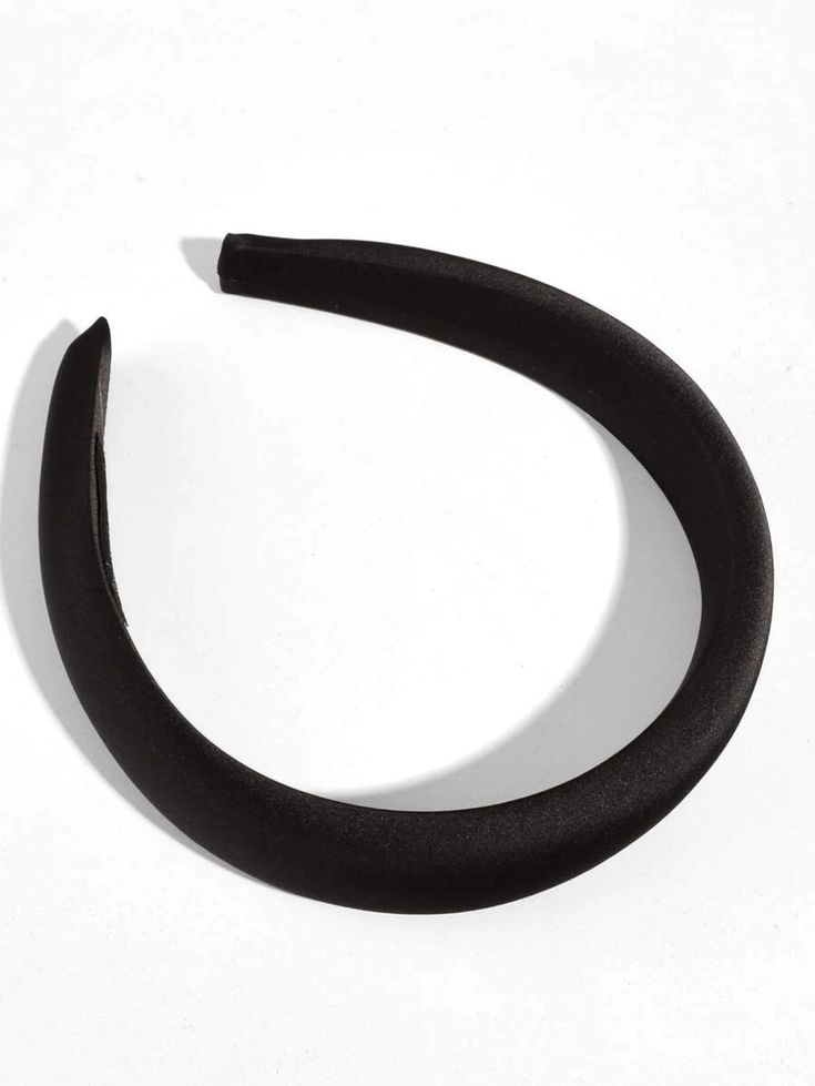 Our storm black padded headband shown against a white background. Highlighting the dark colour, sheen of the satin material and height of the padding in the band. Perfect for bridal events or formal events.