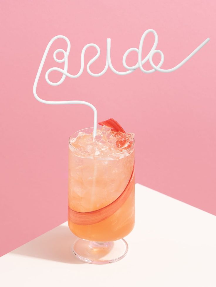Our white BRIDE straw shown in a drink. Highlighting the height and functionality of the straw with large BRIDE lettering. The perfect fun addition for any bridal or hens celebration