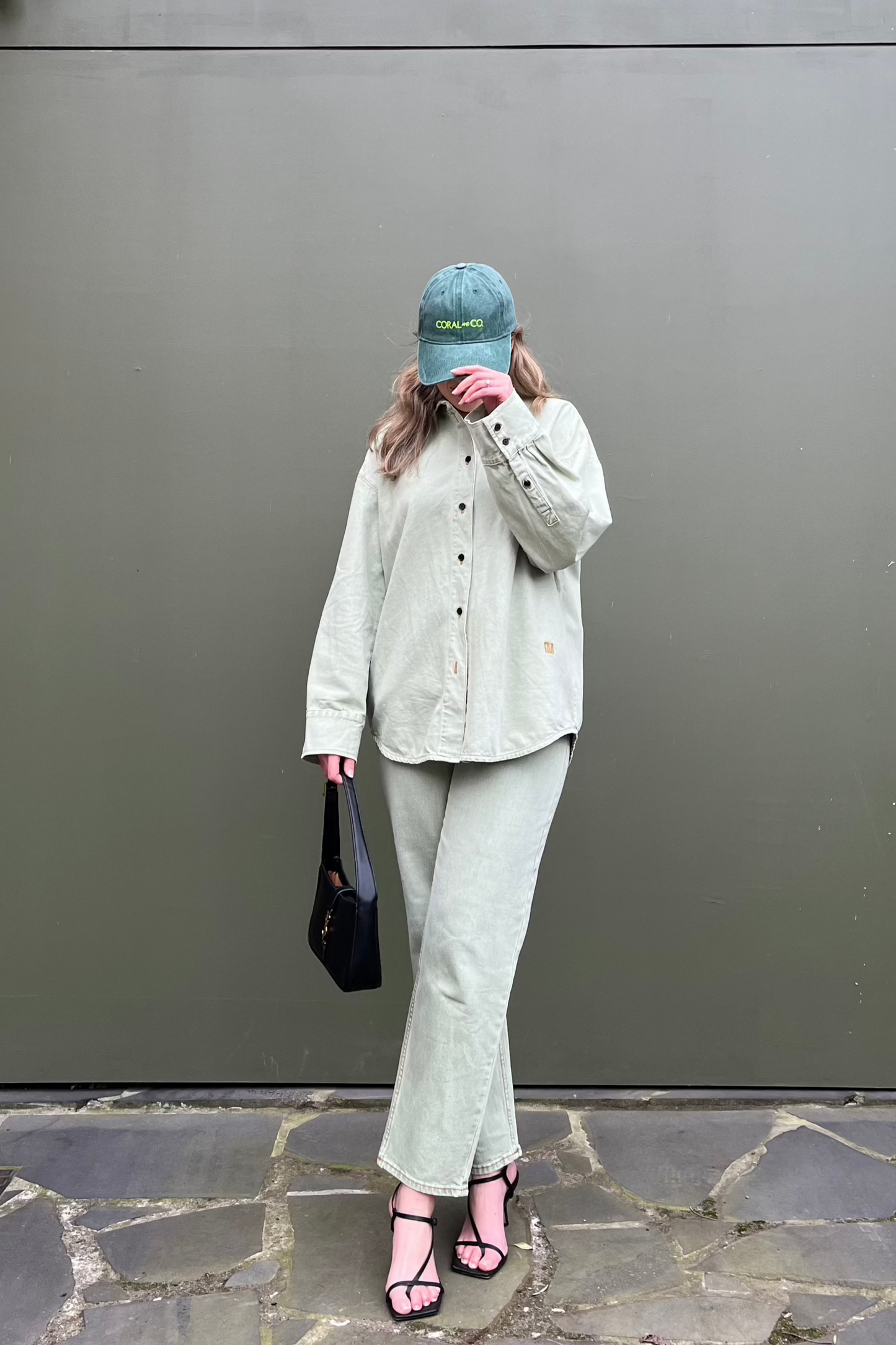 Coral wearing our Green Goddess cap with a pale green denim shirt. Dark green faded denim and featuring a bold fluro green embroidery. Perfect for casual daily wear