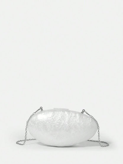 Our Ariel acrylic bag with a glossy finish, oval shape with the sliver shoulder chain attachment. Adding elegance to your outfit or even the bride to be.