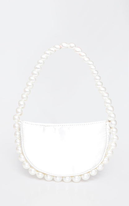 Oour white leather Azalea bag sat hanging to show its size. Showing the pearl beaded handle that continues around the bottom of the bag. A luxury addition to any outfit or bride to be