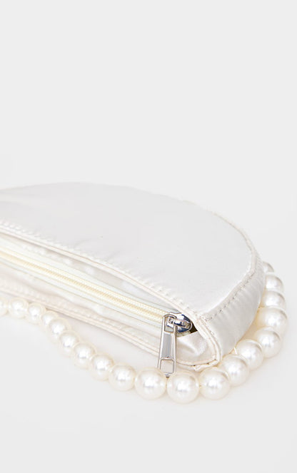 a close up shot of our white silk Azelea bridal bag's zip. A quality silver zip for this bride bag.