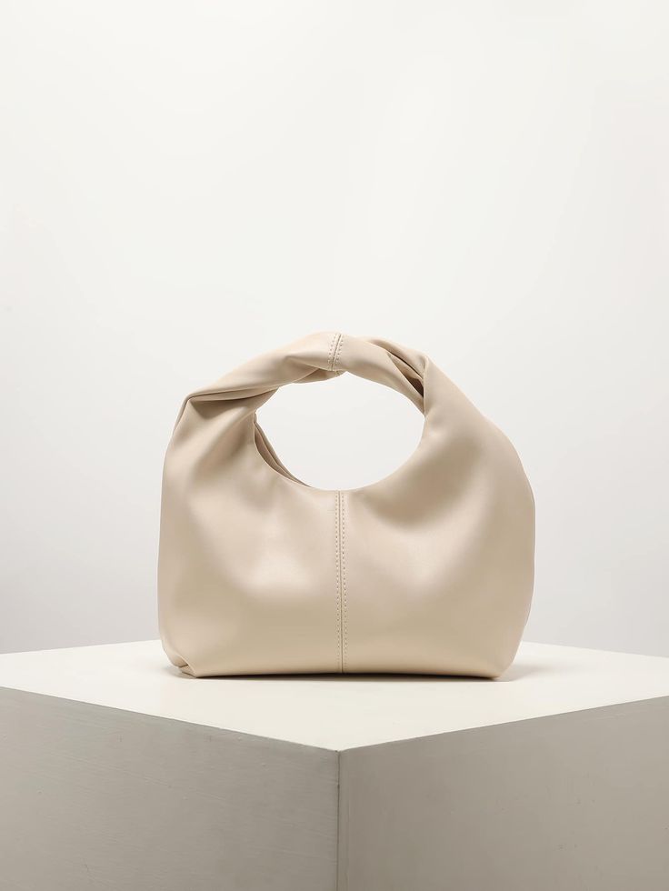 Cream ruched PU leather handbag by CORAL & CO., perfect for bridal showers, weddings, and event styling.