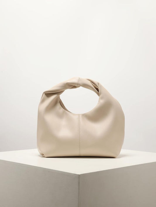 Cream ruched PU leather handbag by CORAL & CO., perfect for bridal showers, weddings, and event styling.