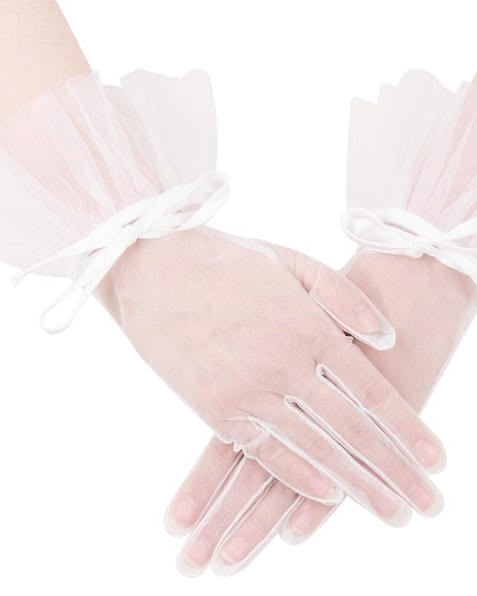 Clear gloves with white ribbons on a white background