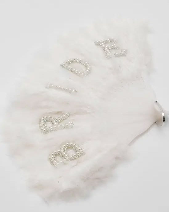 White Bridal Feather Fan laid on a white background