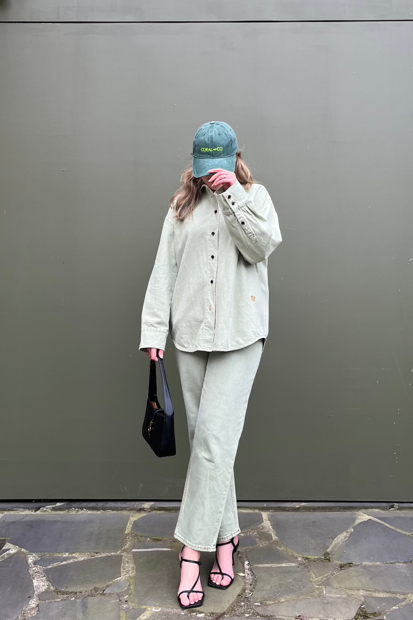 Coral wearing our Green Goddess cap with a pale green denim shirt. Dark green faded denim and featuring a bold fluro green embroidery. Perfect for casual daily wear 